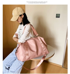 Detail view of large pink yoga gym bag with waterproof material and adjustable strap
