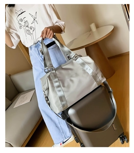 Light grey fitness travel bag with sleeve for suitcase handle attachment