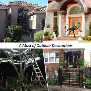 Outdoor Halloween giant spider and white web displayed on house walls and trees