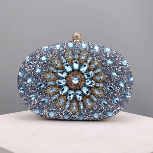 Close-up of blue and silver rhinestones with a central gemstone sunflower design