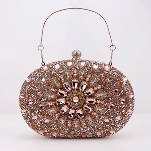 Detail of rose gold evening clutch with rhinestones and pink gemstone flower pattern
