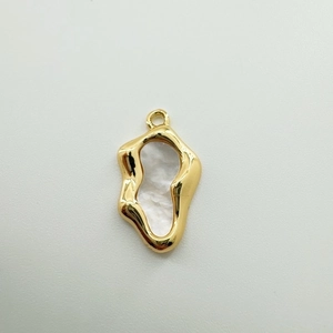 Detailed view of irregular 18K gold plated pendant with white mother of pearl inlay