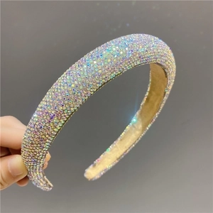 Close-up of sparkling AB rhinestones on a padded headband with detailed craftsmanship