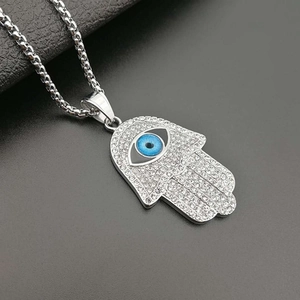 Titanium steel Fatima hand necklace with blue evil eye and diamonds on black background