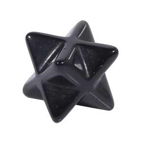 Macro shot of polished black obsidian Merkaba star stone with smooth geometric surfaces