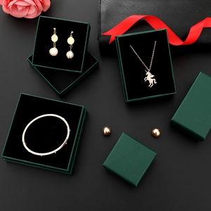 Dark green jewelry gift boxes with black flocking lining and decorative pink flowers