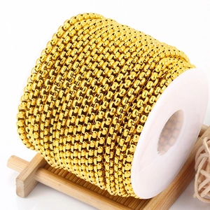 Golden square pearl chain on a white spool for DIY stainless steel jewelry making