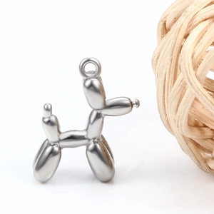 Polished silver stainless steel balloon dog pendant with top ring on white background