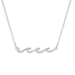 Macro detail of wave pendant with sparkling cubic zirconia on S925 silver necklace