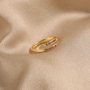 Gold s925 sterling silver open ring with Siempre Juntas engraving on champagne silk fabric