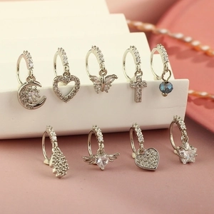 9pcs silver teardrop zircon nose rings set featuring moon and heart charms on display