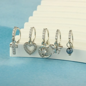 Five-piece silver nose ring set with zirconia cross, moon, and heart charms
