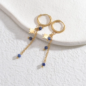 Detail of 14K gold plated stainless steel star earrings with blue beads and dainty chains