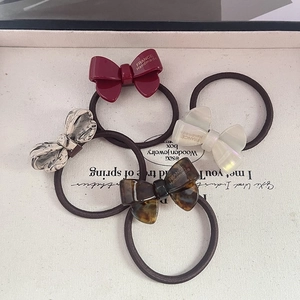 Chic acetate bow hair ties in burgundy, tortoiseshell and marble patterns for women