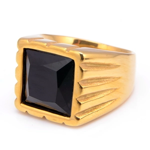 Detailed view of a gold-tone stainless steel ring featuring a square black gemstone and texture