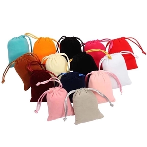 Assorted colorful velvet drawstring pouches for jewelry and gift packaging display