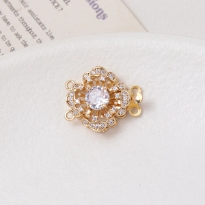 Macro shot of 14K gold-plated flower clasp with micro-set zircons for jewelry making
