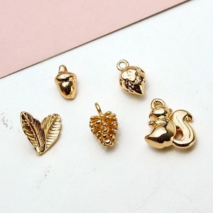 Golden metal charms set featuring squirrel pinecone and acorn leaf for jewelry making
