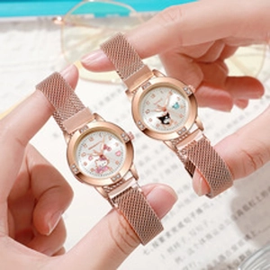 Detail of rose gold quartz watch with Sanrio characters and rhinestone bezel dial