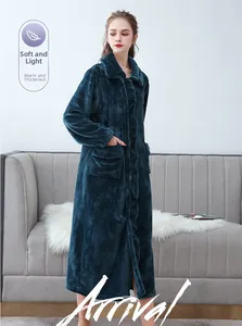 Detailed close-up of thick flannel bathrobe with large pockets and soft thermal fleece texture