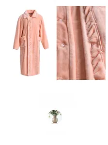Detail view of pink coral fleece bathrobe with large pockets and soft plush texture