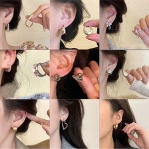 Collection of nine luxury stud earrings with zircons and pearls for a diverse look