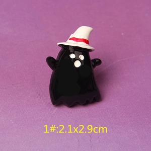 Detail view of a resin black ghost with a white witch hat for Halloween DIY crafts