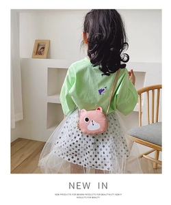 Pink kitten crossbody bag shown on a young girl for size and style reference