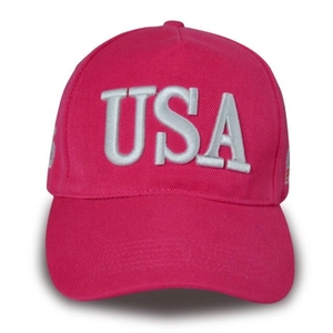 Detail of white 3D USA embroidery on a vibrant rose red baseball cap with textured fabric