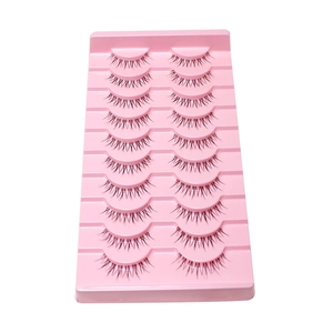 Set of 10 pairs of natural black false eyelashes in a pink tray on a white background