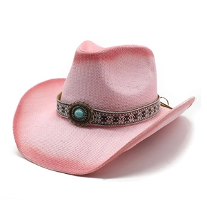 Pink woven straw cowboy hat with ethnic print band and turquoise stone accent for beach