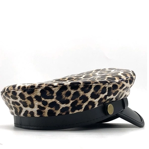 Stylish leopard print military hat with black leather brim and gold button detail