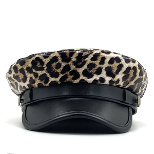 Leopard print military cap with black leather brim and vintage metal button accents