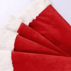 Christmas tree skirt with red plush fabric and white faux fur border with silver glitter