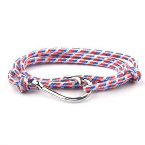 Detailed shot of tricolor braided nautical bracelet with silver fish hook clasp