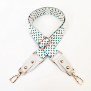Adjustable green and white geometric woven shoulder strap with gold hooks for handbags
