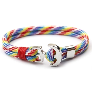 Detailed shot of rainbow paracord bracelet featuring a polished silver anchor metal clasp