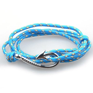 Detail of blue and orange braided rope bracelet featuring a silver metal fish hook clasp
