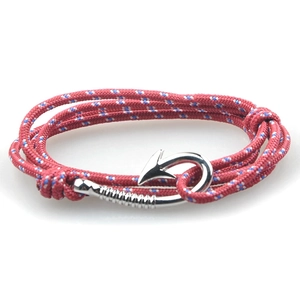 Detailed view of red nautical braided rope bracelet with blue accents and metal anchor hook