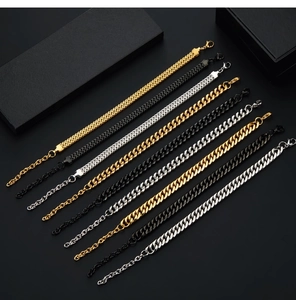 Detailed view of woven punk Cuban bracelets in gold, silver, and black finishes