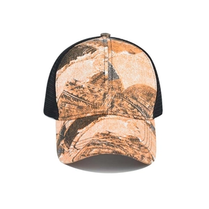 Detail of tie-dye camo print cotton panels and breathable mesh back of the trucker hat