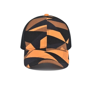 Detail of a tie-dye mesh baseball cap with orange and black camo pattern and breathable mesh