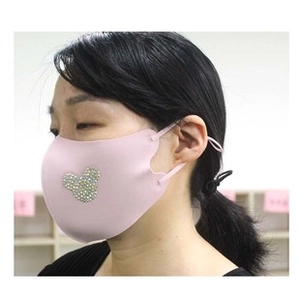 Detail of pink foam face mask featuring a sparkling rhinestone mouse head decoration