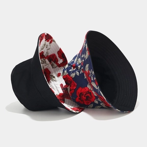 Reversible bucket hat with floral rose pattern and solid color cotton canvas design
