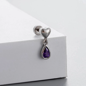 Titanium steel heart stud earring with purple pear-cut zircon on white geometric background