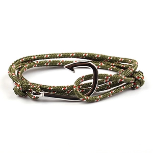 Detail of silver fish hook anchor and green braided nautical rope bracelet for couples