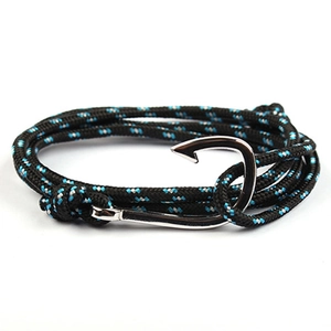 Detail of nautical braided rope bracelet with a metallic silver fish hook anchor clasp