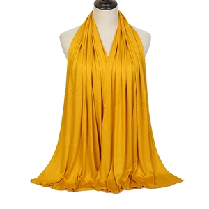 Bright yellow mercerized cotton scarf with elegant drape for sun protection