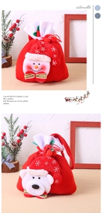 Detail of Christmas candy bags featuring plush snowman and polar bear doll decorations