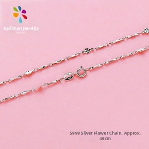 Macro detail view of a S999 sterling silver lathe flower chain with spring ring clasp.